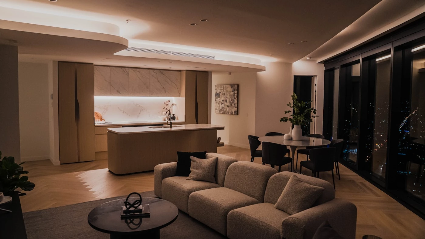 Modern Dubai apartment interior at night with city views — managed holiday home